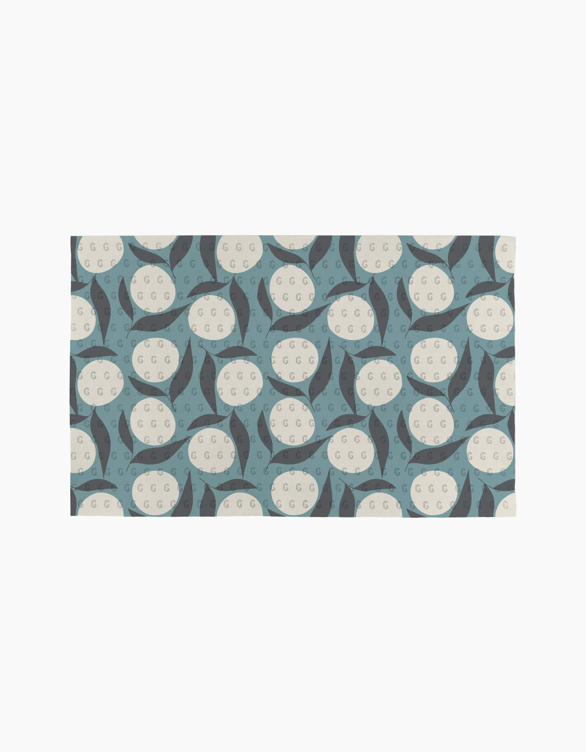 Polka Dot Blooms by Lizzie Clark features a repeating geometric pattern of cream circles with small dots and blue, dark gray crescents on a light background—ideal for pairing with eco-friendly or reusable paper towels.