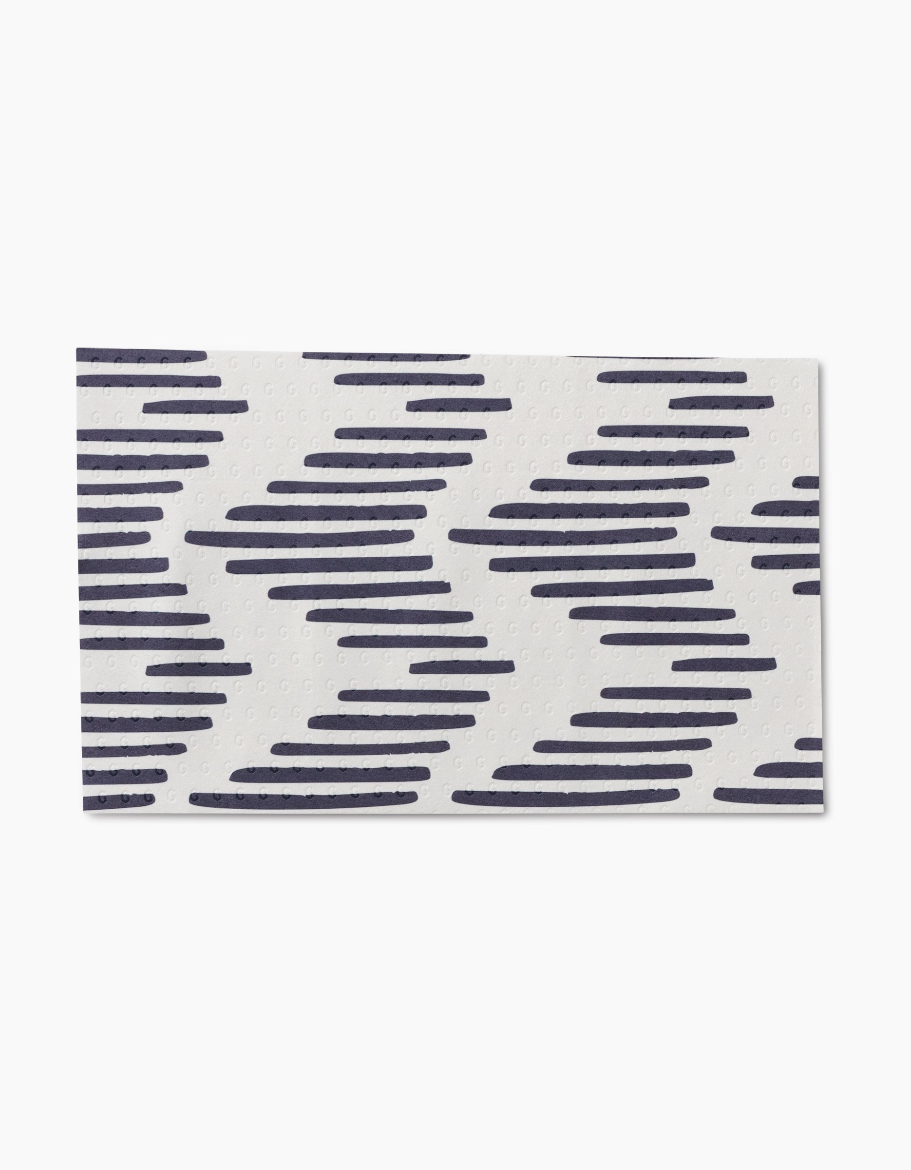 Pop Of Color by GEOMETRY is a rectangular white mat with diagonal navy blue zigzag lines, made from post-consumer recycled materials for an eco-friendly touch.