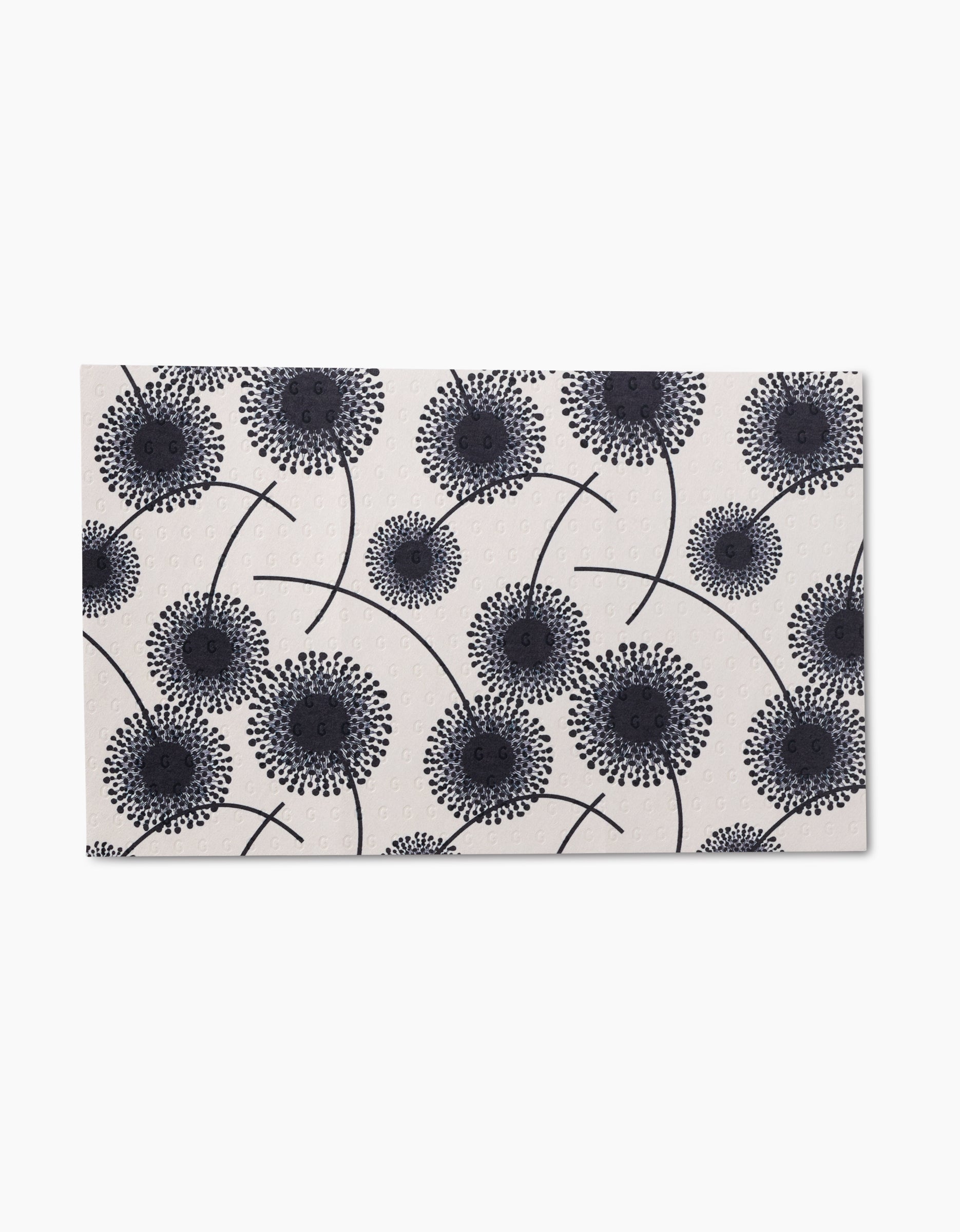 Pop Of Color by GEOMETRY is a rectangular tile with a white background and black stylized dandelion seed head patterns, inspired by eco-friendly Not Paper Towels made from post-consumer recycled materials.