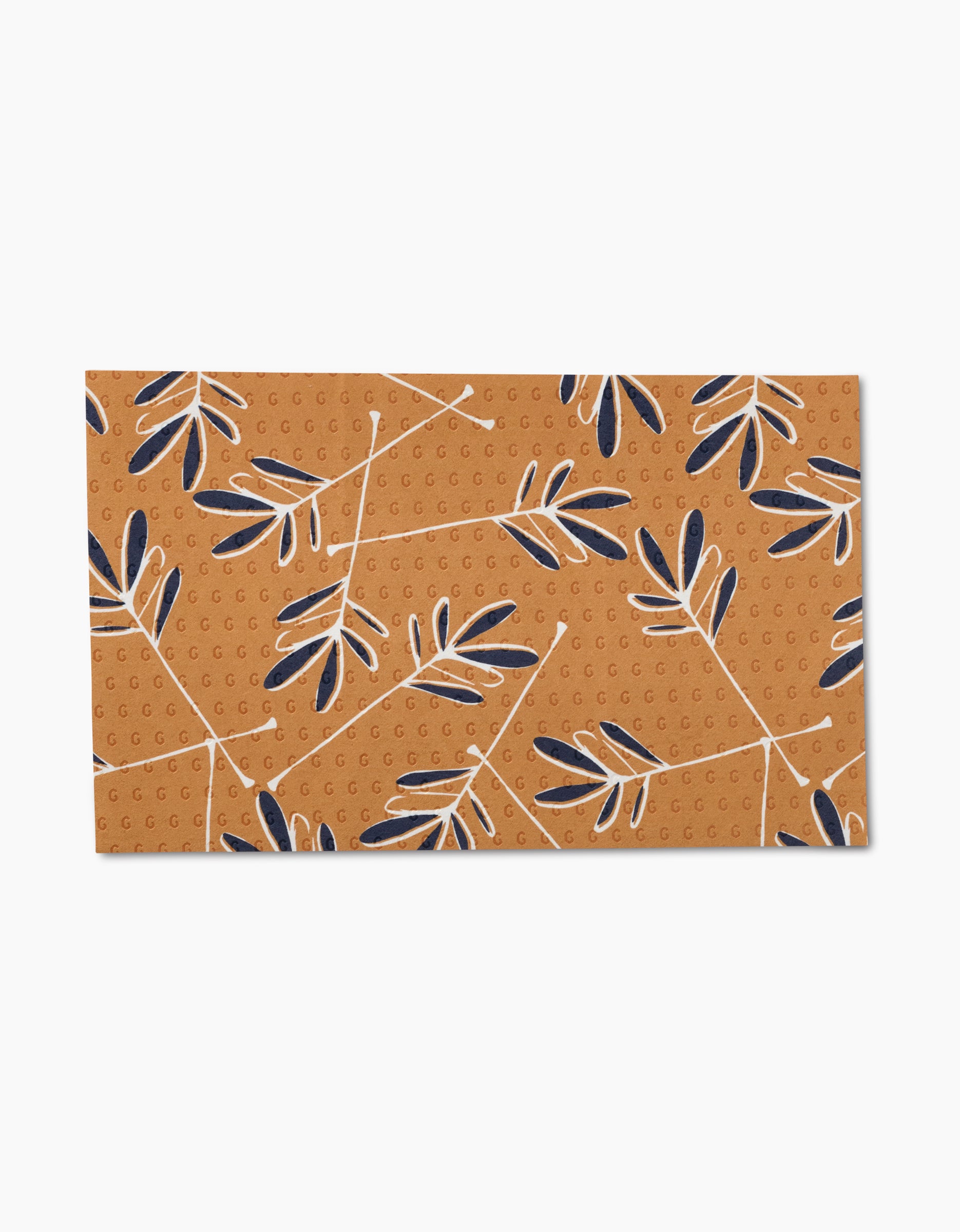 The GEOMETRY Pop Of Color mat features a brown background with a dotted texture and white branches adorned with dark blue and beige leaves—a sustainable choice made from post-consumer recycled materials.