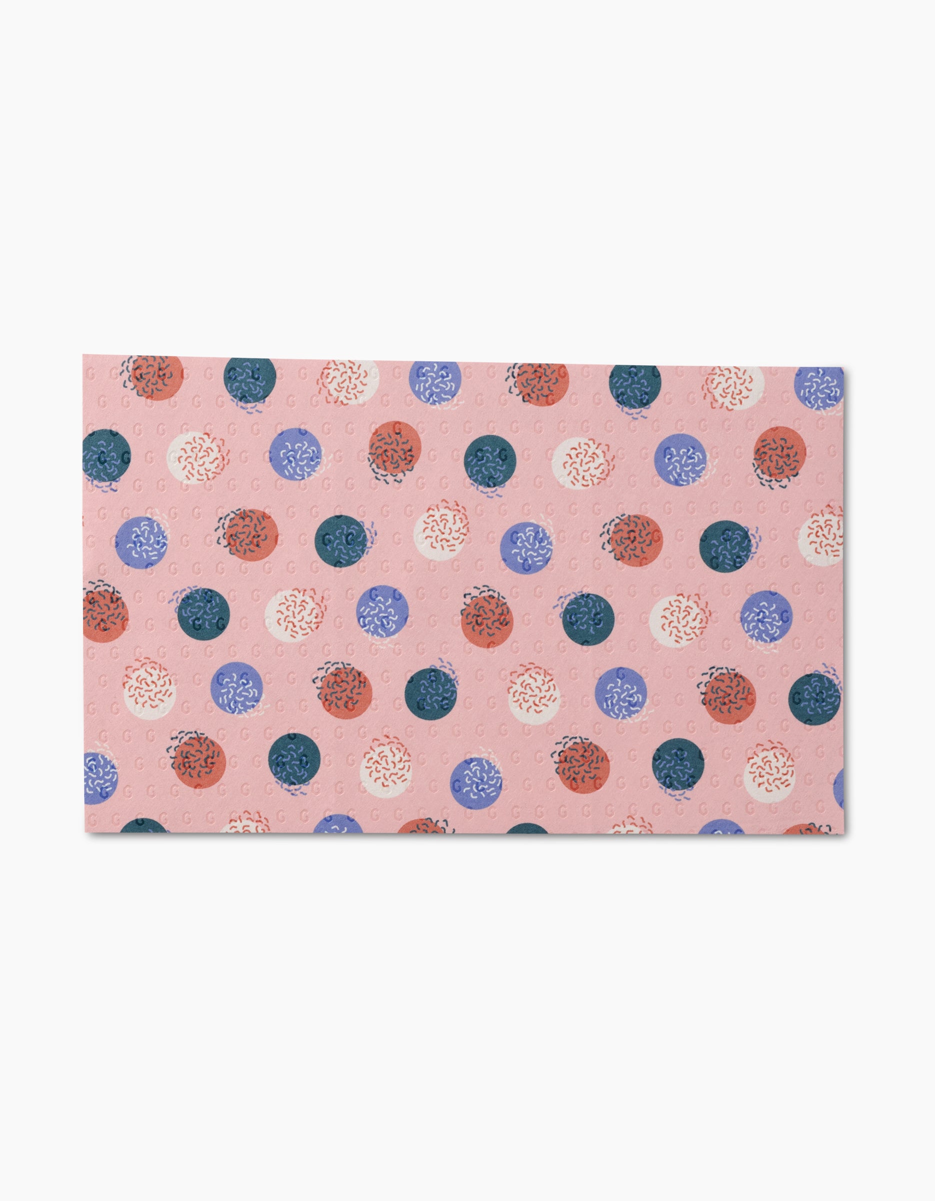 Rainbow Cutouts by Claire Iglesias: a rectangular card with a pink background and a pattern of red, blue, purple, and white polka dots with squiggly lines inside—perfect for displaying eco-friendly cleaning or reusable paper towels.
