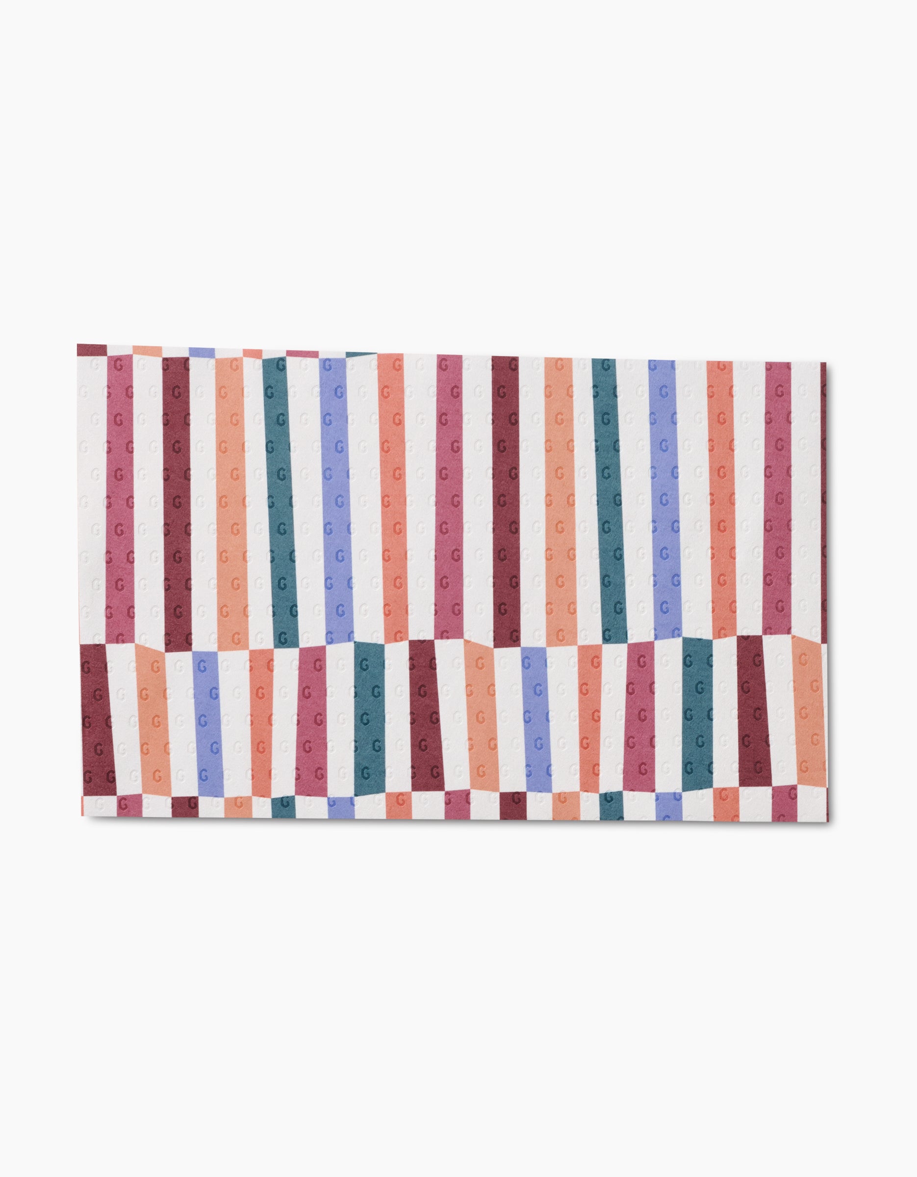 The Rainbow Cutouts towel by Claire Iglesias is rectangular with vertical stripes in red, pink, orange, blue, and green. Made from eco-friendly materials, it features a wavy design and an embossed G monogram for extra style.