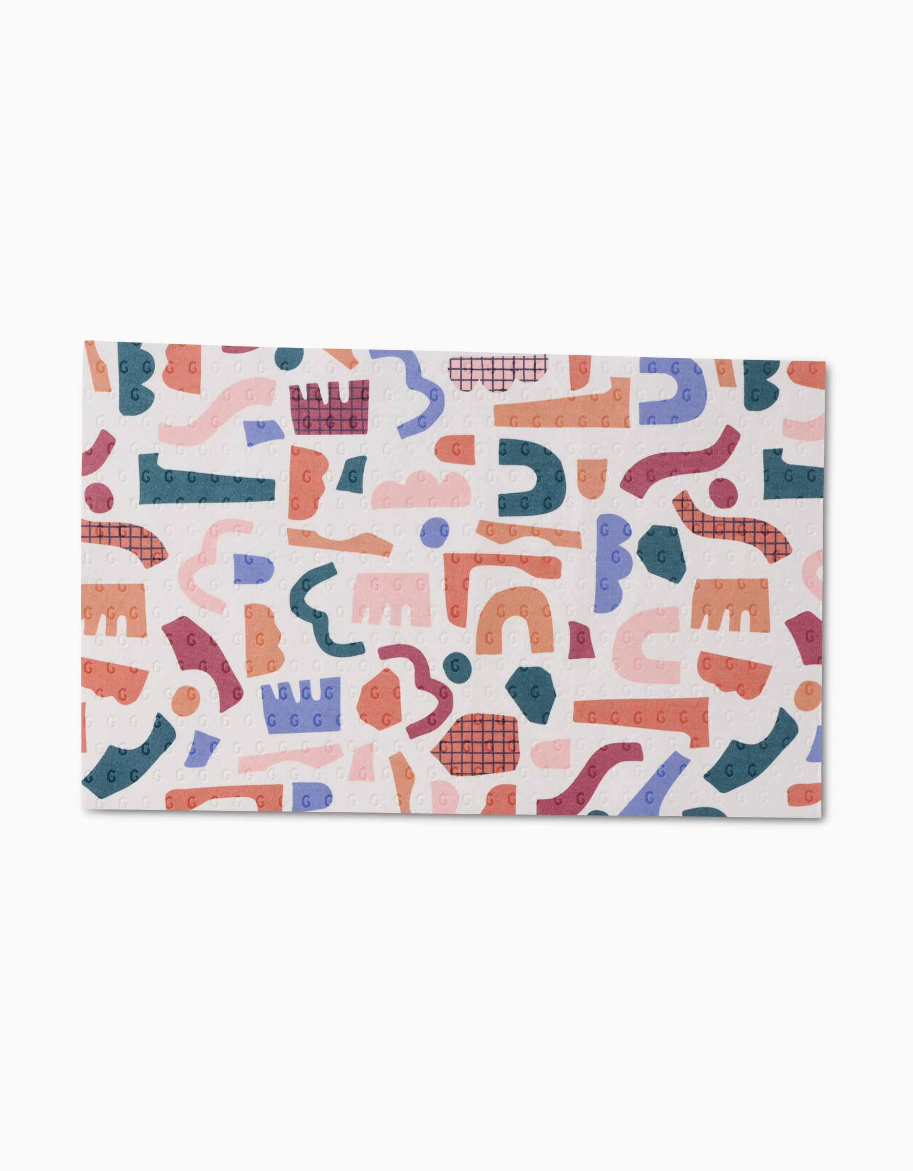 Rainbow Cutouts by Claire Iglesias features abstract geometric shapes in blue, orange, pink, and red on white with dot and grid textures—ideal for reusable paper towels or other eco-friendly cleaning products.