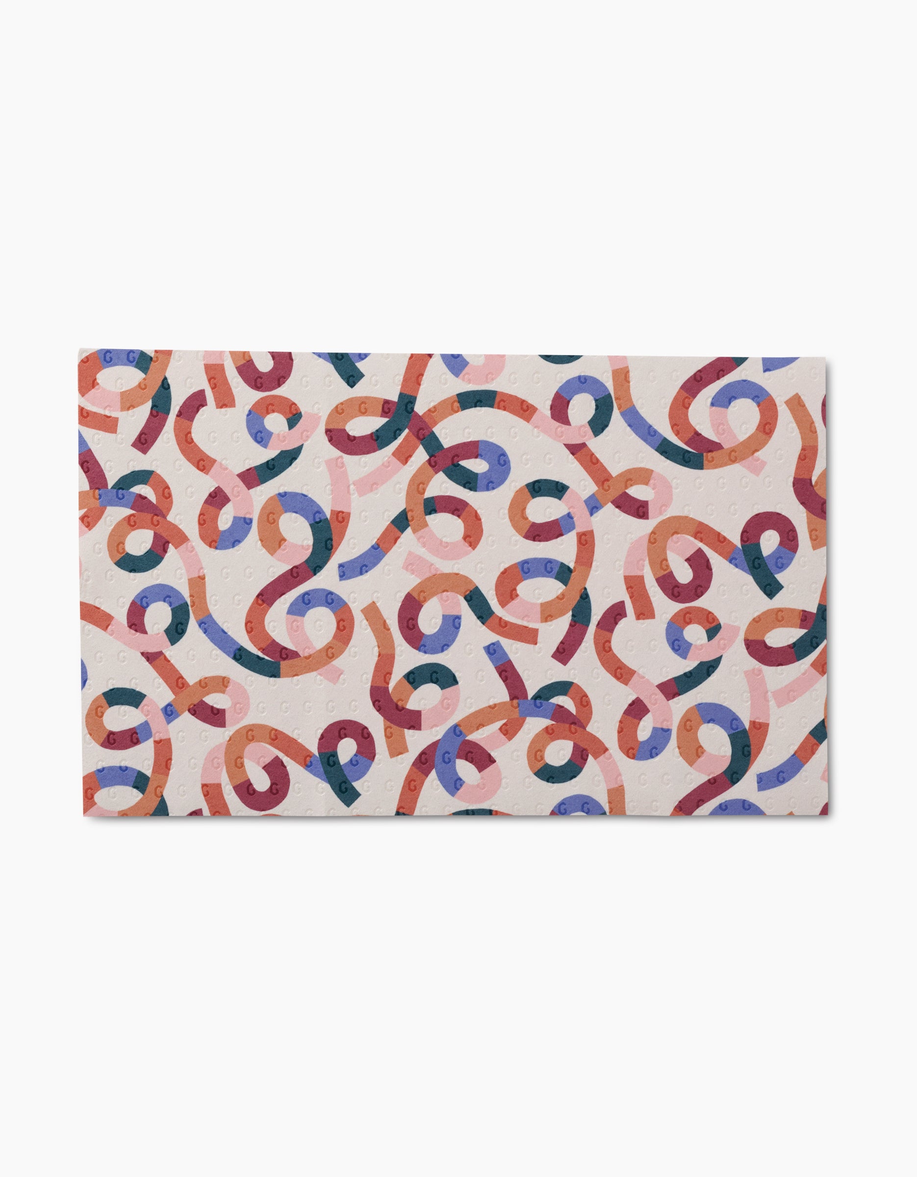 The Claire Iglesias Rainbow Cutouts mat features an abstract pattern of twisting, colorful ribbons on a white background—crafted from post-consumer recycled materials for an eco-friendly touch.