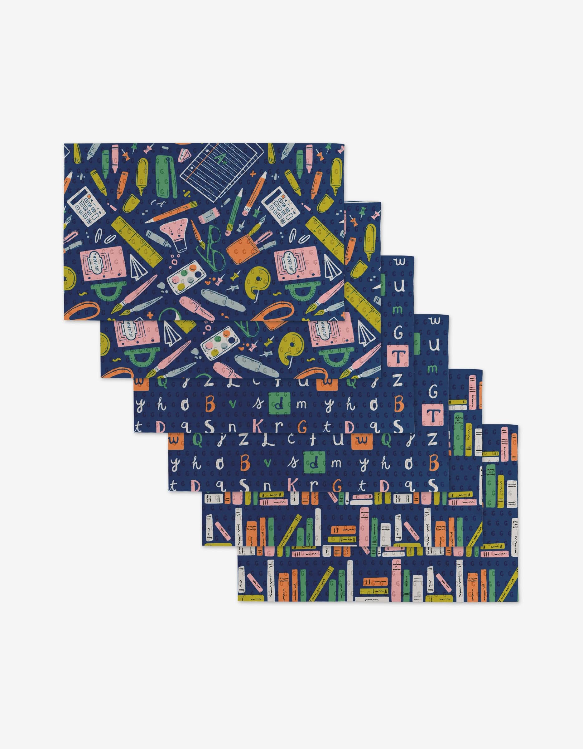 School Days by Amy MacCready features five folded fabric pieces with colorful school-themed prints on navy blue, made from eco-friendly post-consumer recycled materials.