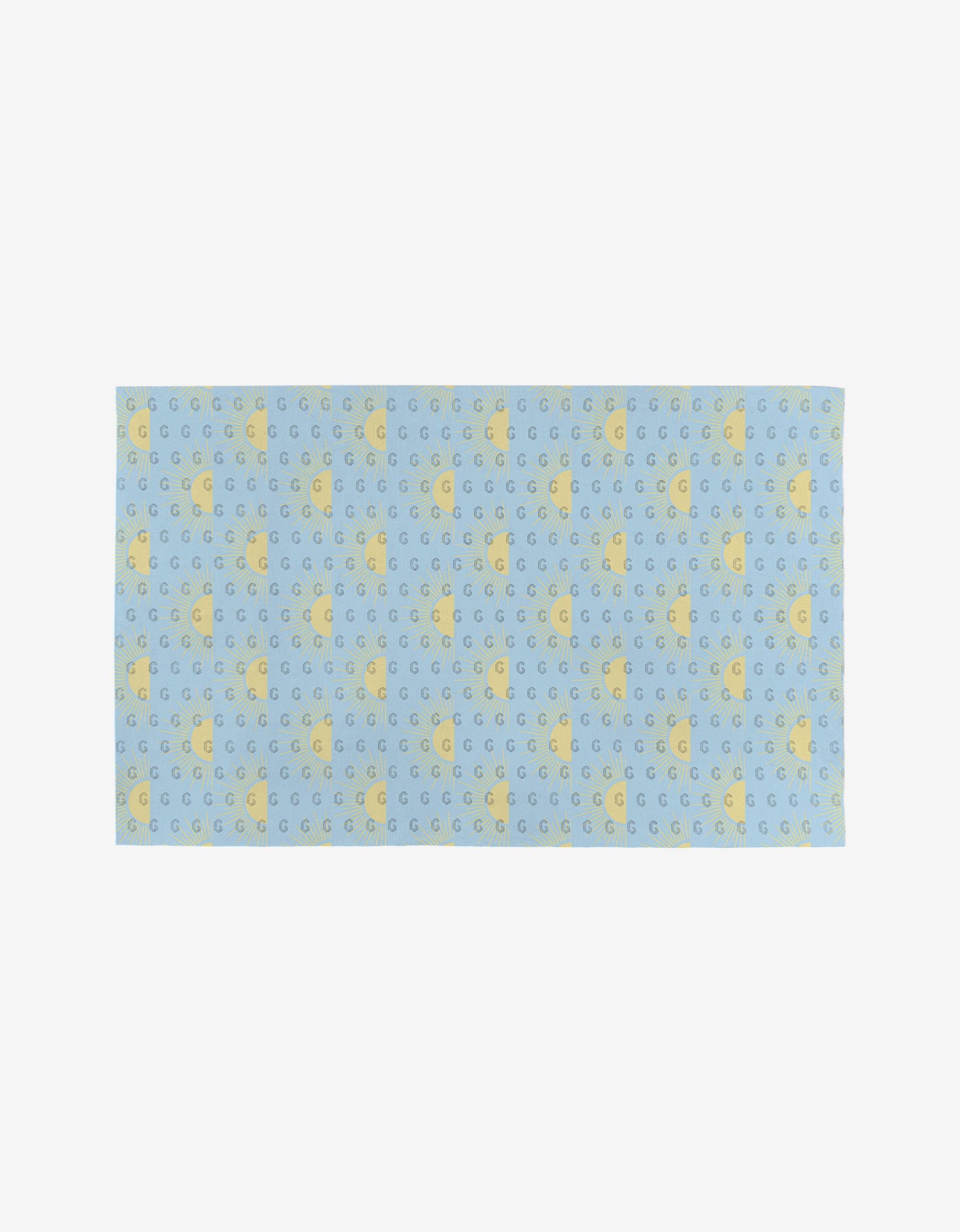 The GEOMETRY “Soft Summer Sun” is a rectangular blue cloth made from post-consumer recycled materials, featuring rows of yellow stars and crescent moons on a plain white background.