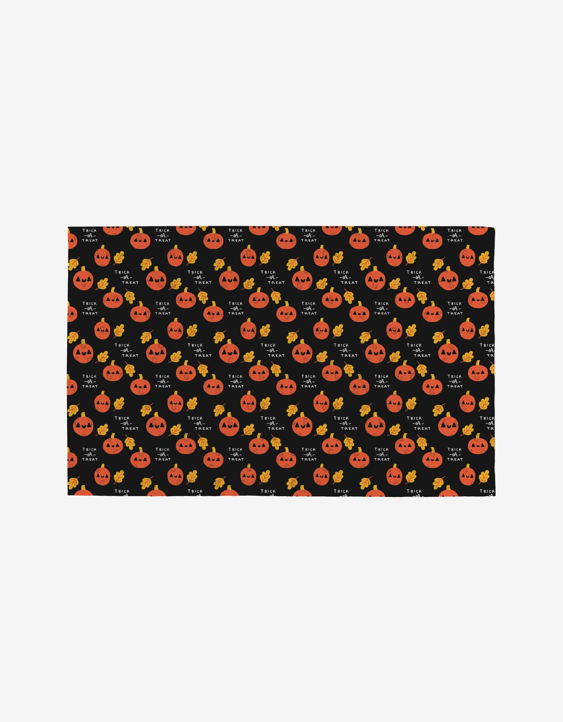 Spooky Season by Genna Blackburn is a black rectangular cloth made from post-consumer recycled materials, featuring smiling orange jack-o-lanterns and yellow stars for a festive, eco-friendly Halloween touch.