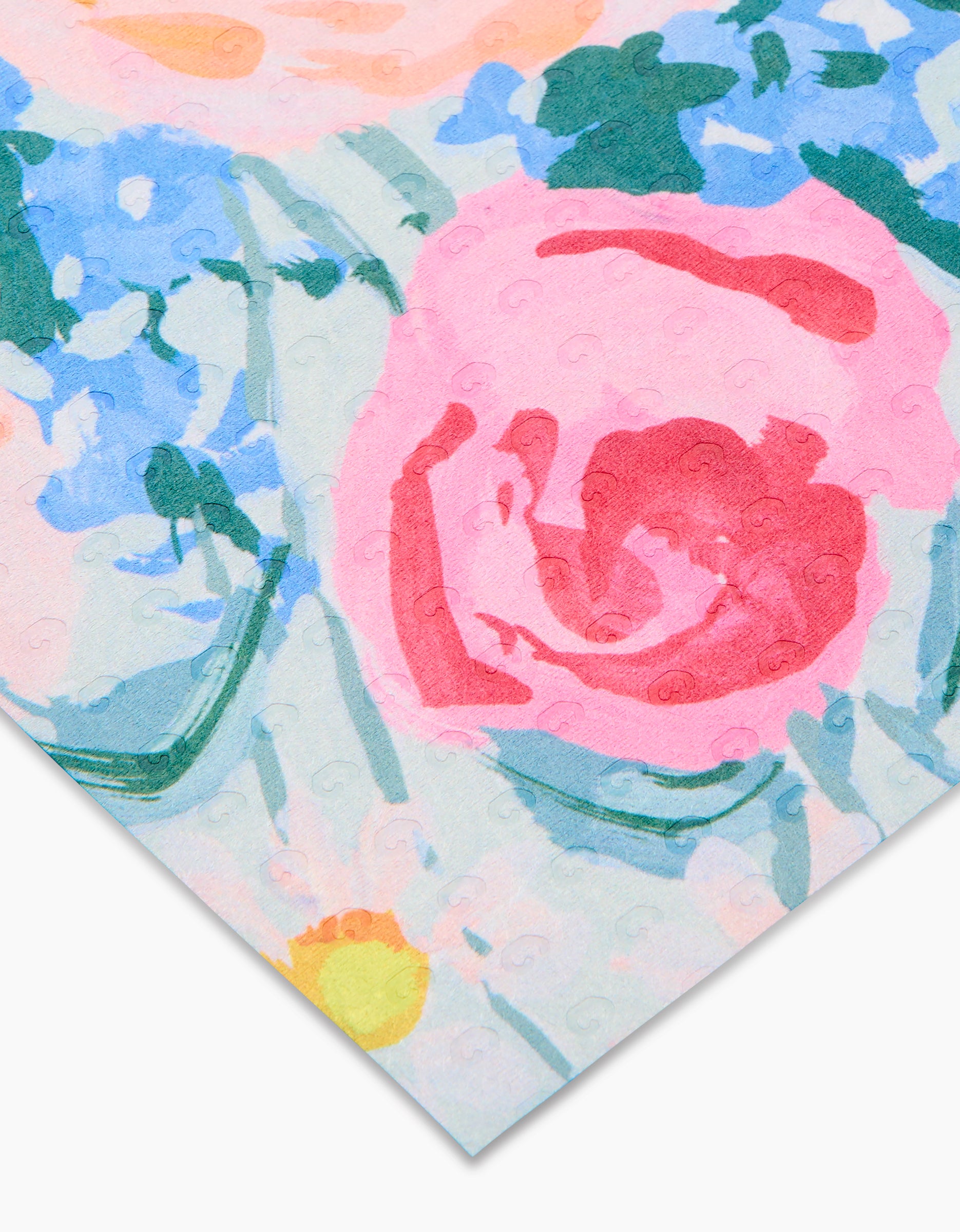 A close-up of the Suzzy and Margot paper napkin by Ania Zwara Art, featuring an abstract floral pattern in pink, blue, green, and yellow on eco-friendly recycled material with textured swirl details.