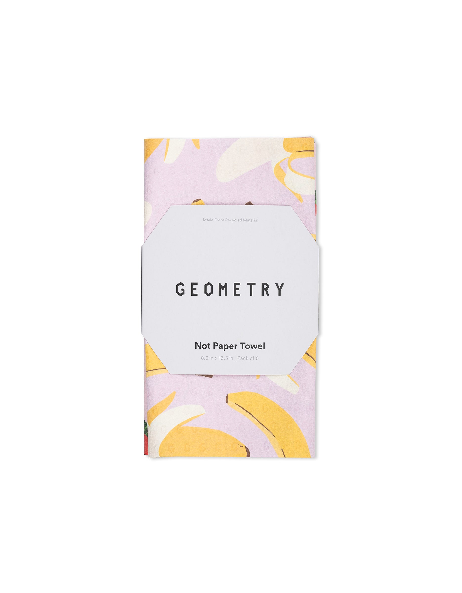 A folded reusable towel from GEOMETRY’s Sweet Summer Mix 2, featuring a banana pattern on a light background, wrapped in Not Paper Towels packaging—an eco-friendly home alternative.