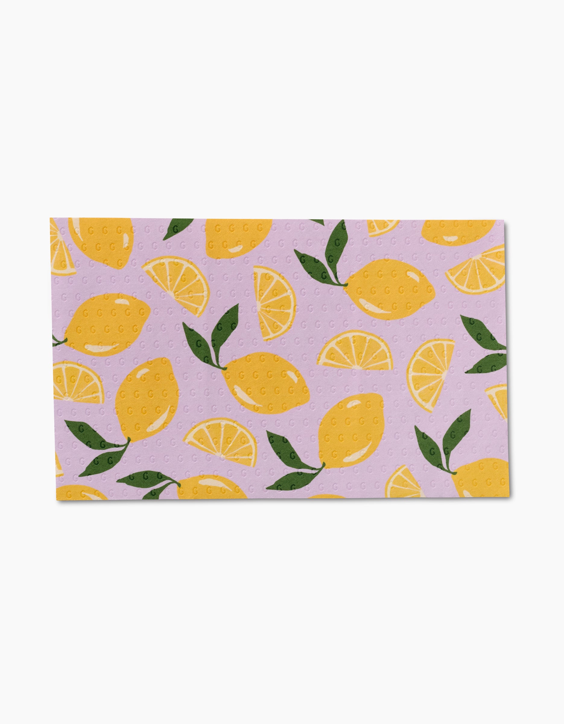 The GEOMETRY Sweet Summer Mix 1 is a rectangular, eco-friendly dishcloth featuring whole lemons, lemon slices, and green leaves on a light purple background—a charming alternative to Not Paper Towels.
