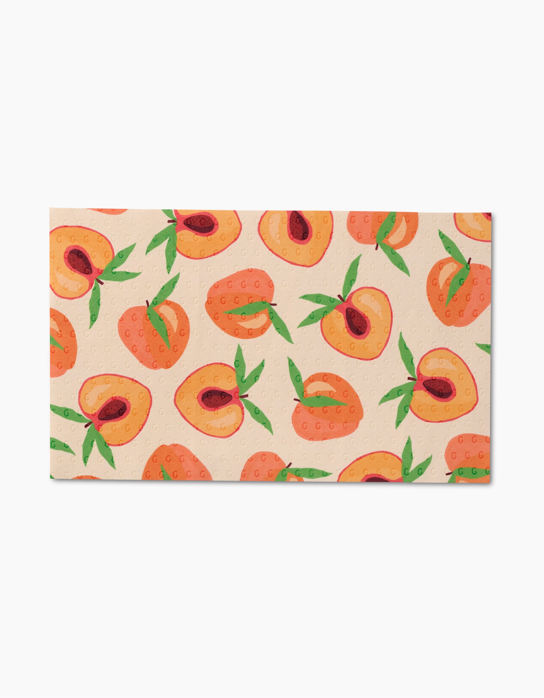 The GEOMETRY Sweet Summer Mix 1 is a rectangular beach towel made from post-consumer recycled materials, showcasing whole and halved peaches with green leaves on a light background.
