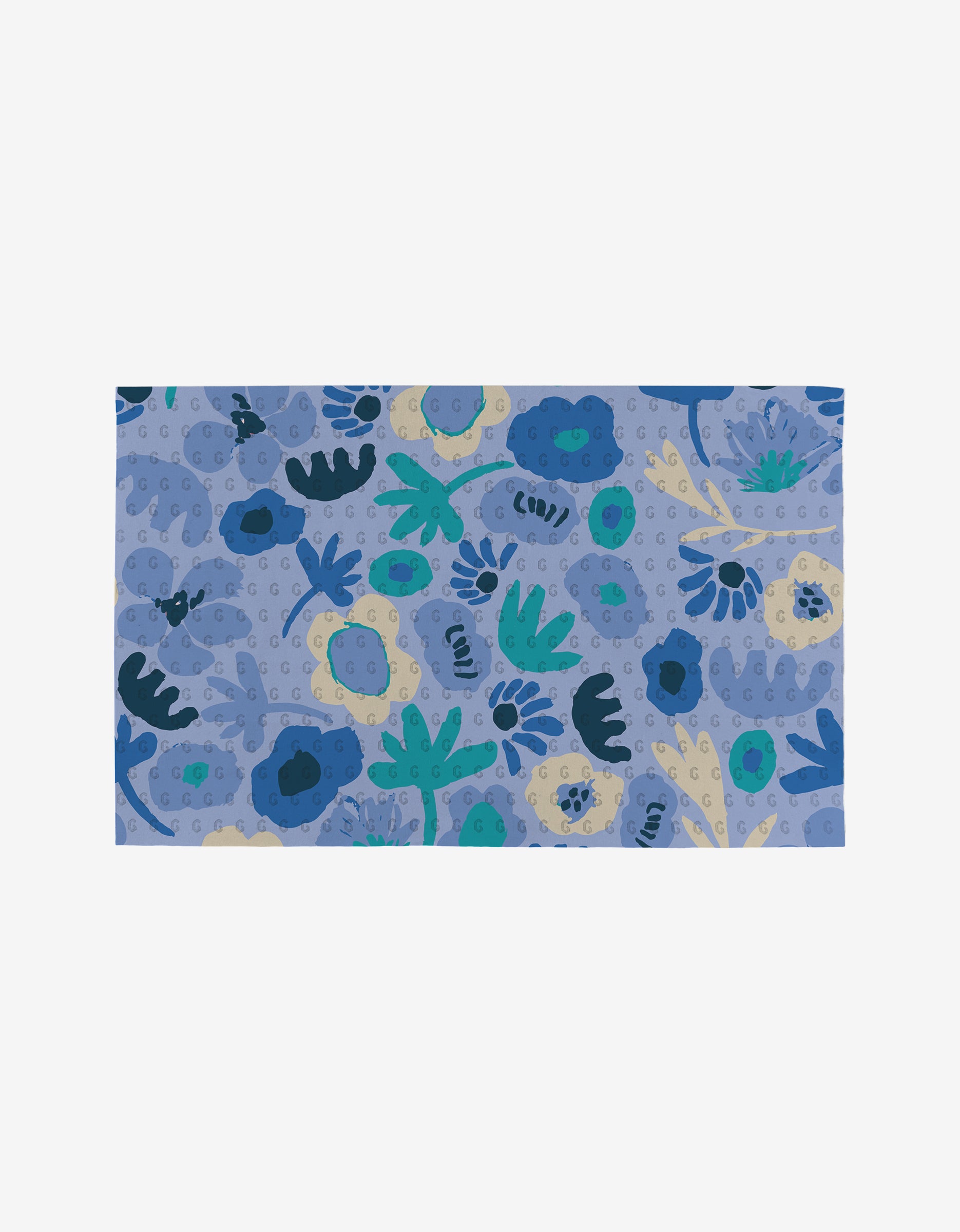 The Sareka Unique Unique mat features a blue background with an abstract floral pattern in blue, teal, cream, and green. Made from eco-friendly post-consumer recycled materials, it showcases scattered flower and leaf shapes.