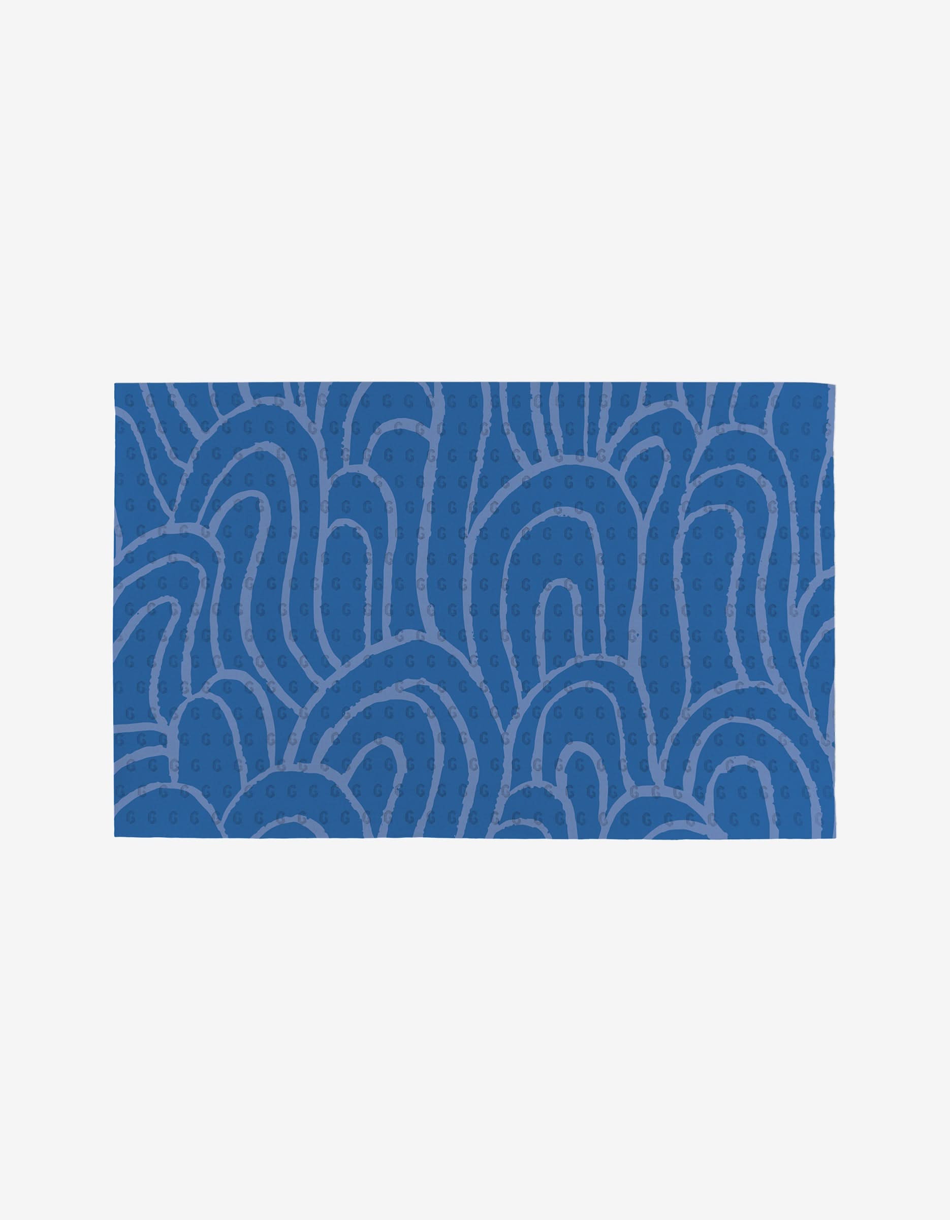 The Sareka Unique Unique towel is a blue rectangle with an abstract pattern of curving lines and small dots in lighter blue on a plain white background, made from eco-friendly post-consumer recycled materials.