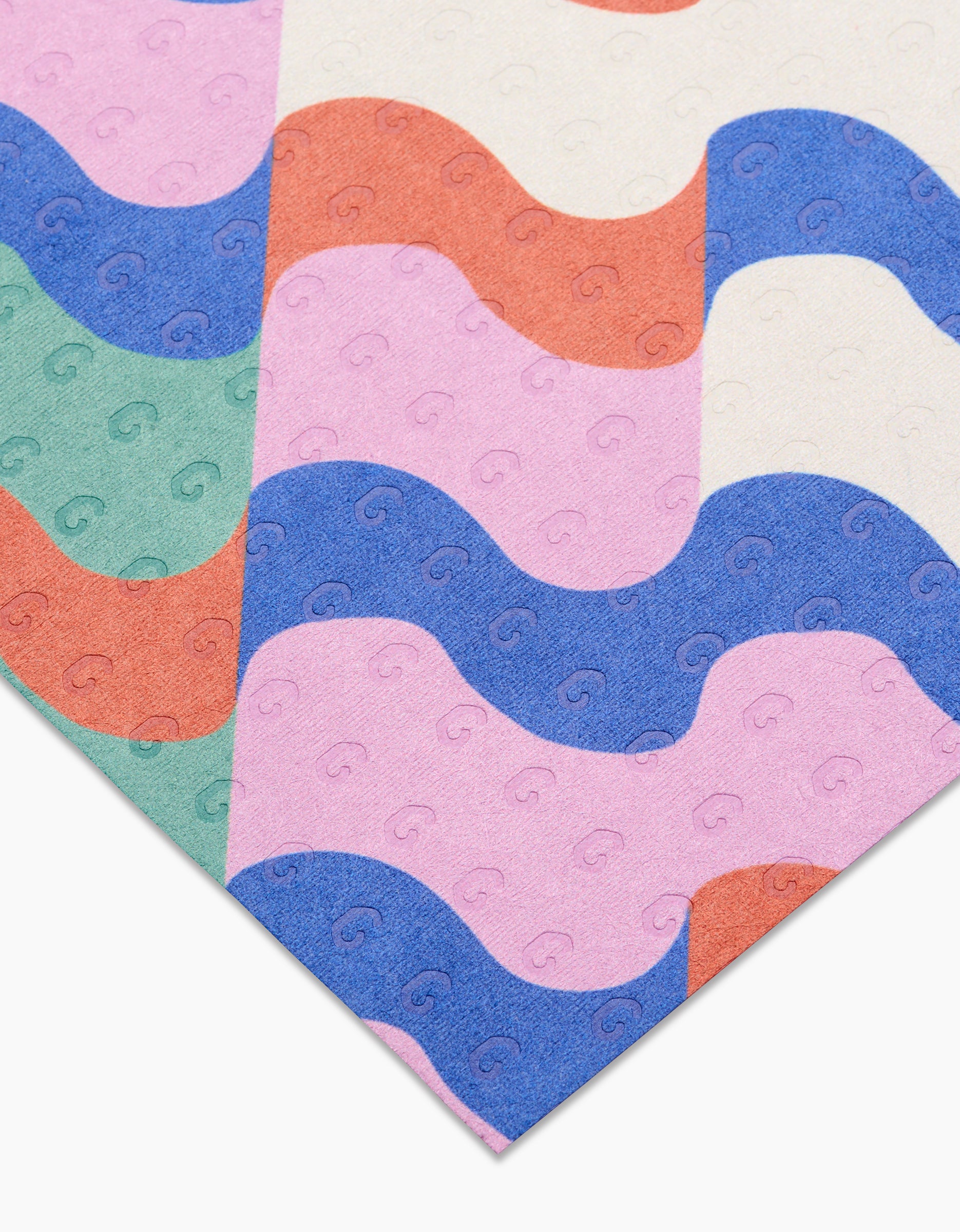 A close-up of Claire Iglesias’ Wavy Stripes reusable fabric, featuring diagonal green, orange, blue, pink, and white wavy stripes with a subtle repeating pattern—ideal for Not Paper Towels.
