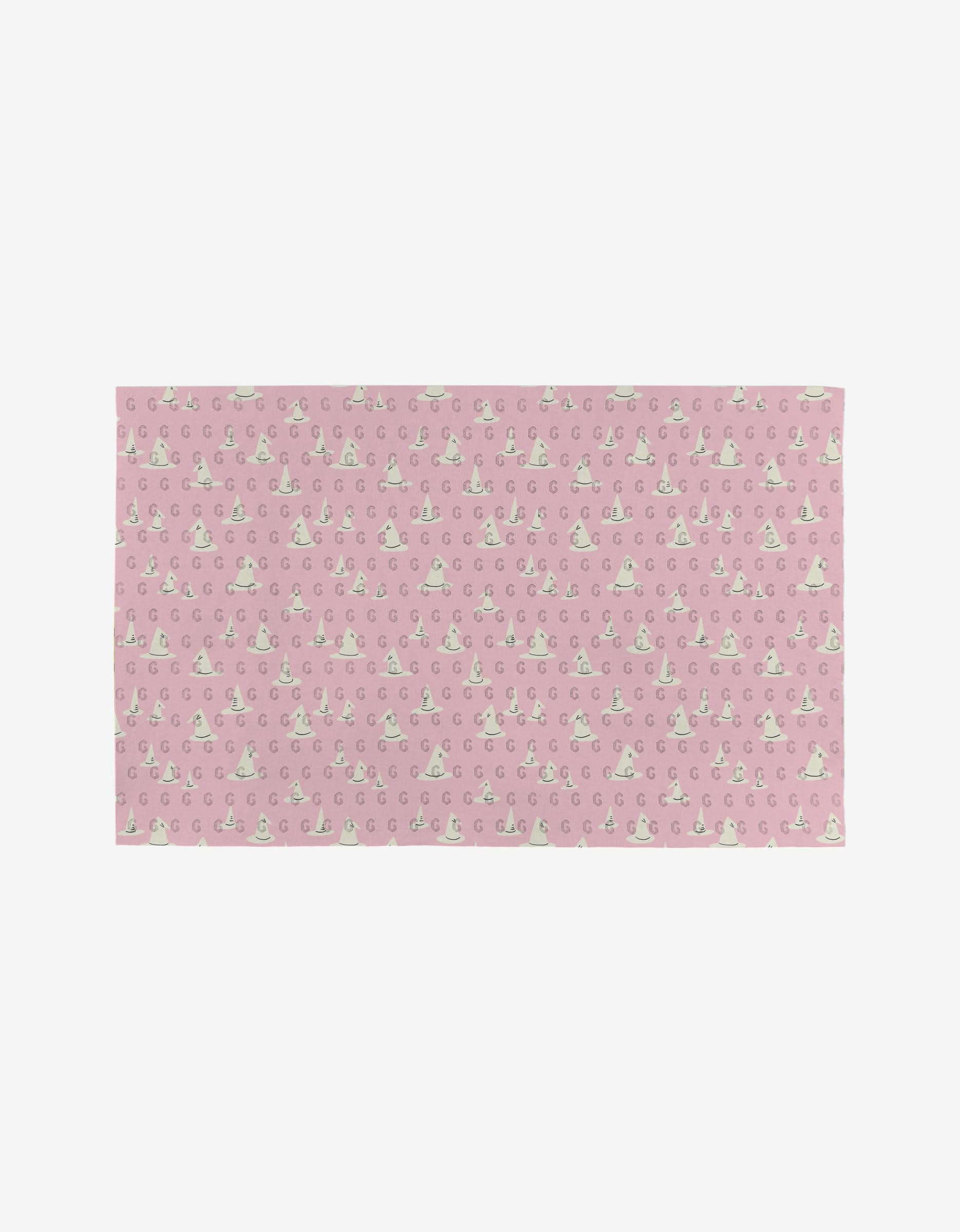 The Witchy Season mat by Amy MacCready is a rectangular pink mat made from recycled materials, featuring white clouds, crescent moons, and stars—a charming, eco-friendly addition to any space.