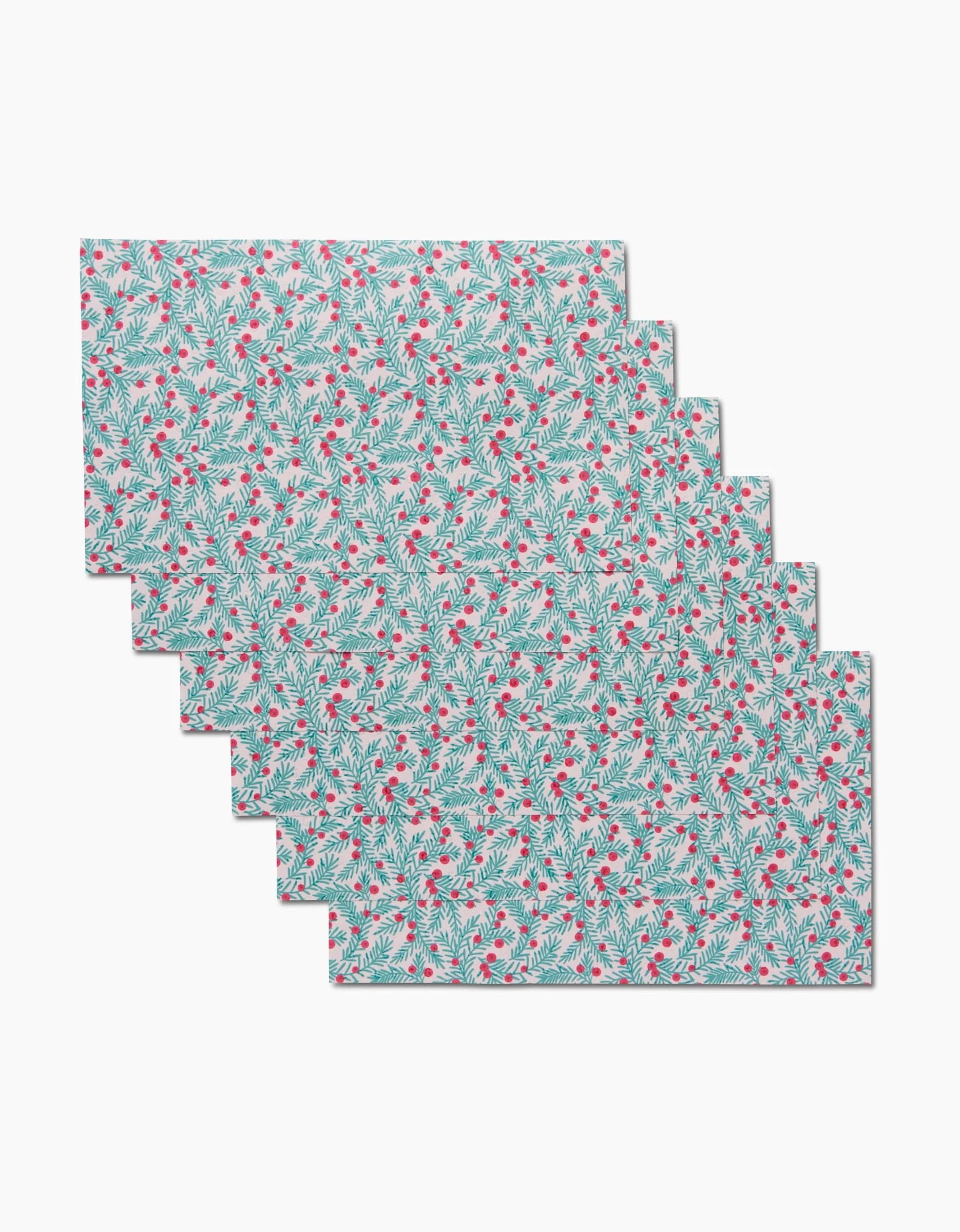 Six rectangular, machine washable Yew Branches placemats by Sarah Daugherty feature a repeating pattern of red flowers and green leaves on a light blue background—an eco-friendly, stylish dining upgrade.