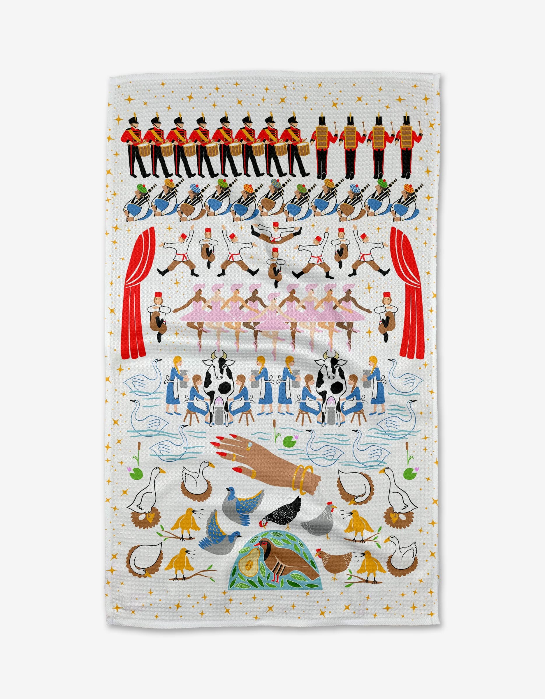 Elisabeth Wing’s 12 Days of Christmas tea towel features Geoweave fabric with nutcrackers, ballerinas, toy soldiers, cows, and more from the classic song, displayed beneath festive red curtains.