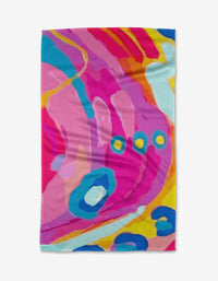 Abundance by Sareka Unique is a vibrant tea towel with swirling pink, blue, yellow, and orange shapes, layered wavy patterns, and circular accents—crafted from recycled materials for sustainable style.