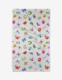The Alphabet Monsters tea towel by Vaishali Design Studio features playful, colorful letters with cartoon faces and fun decorations—adding charm and absorbency to your kitchen.