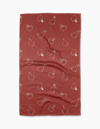 The Linda Fox Apples and Pears recycled kitchen towel features a red background with white outlined apples and pears in a repeating pattern.