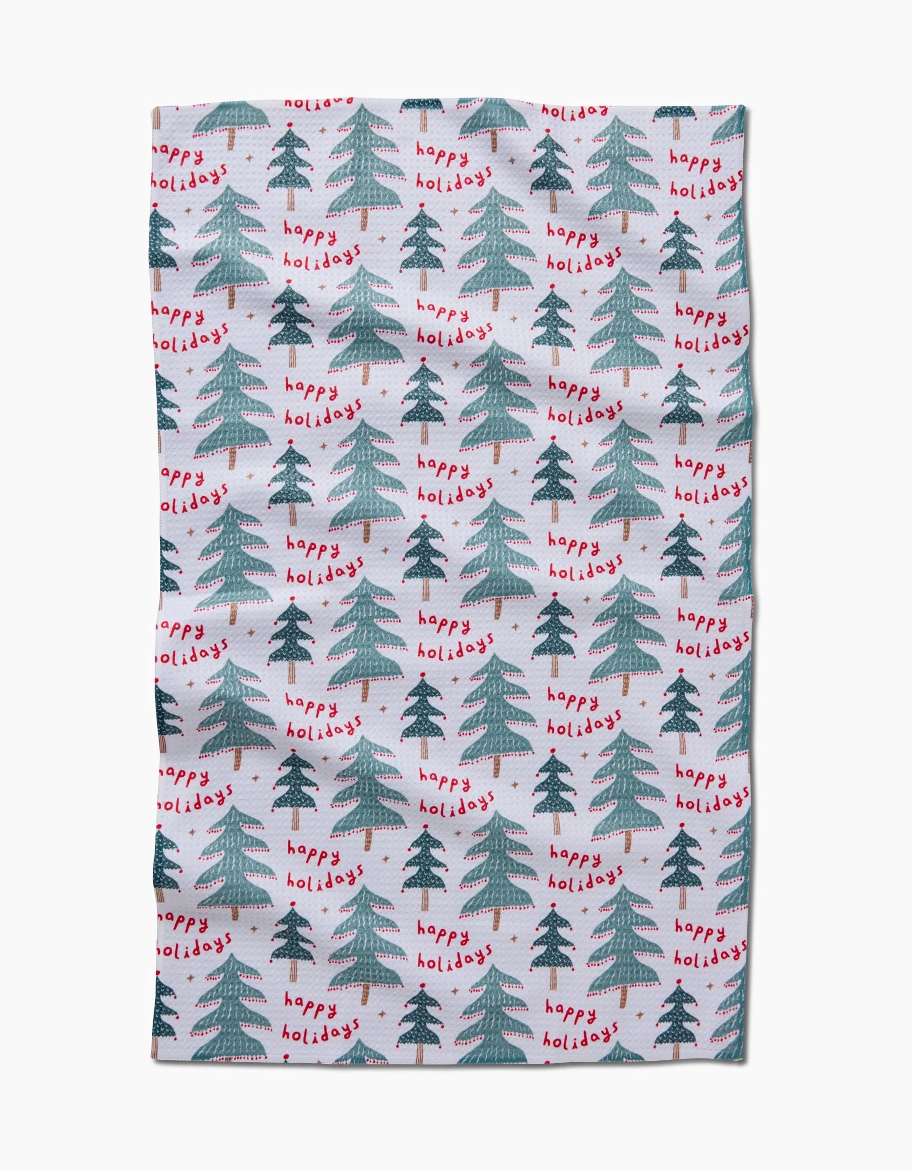 The Berry Happy Holidays tea towel by Roxy Marj features green Christmas trees and red happy holidays text on a white background, made from quick-drying recycled materials.