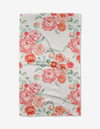 The Blush Florals towel by Elena Fay features pink and orange peonies with green leaves in a scattered watercolor style, crafted from ultra-absorbent Geoweave fabric for quick drying and maximum efficiency.