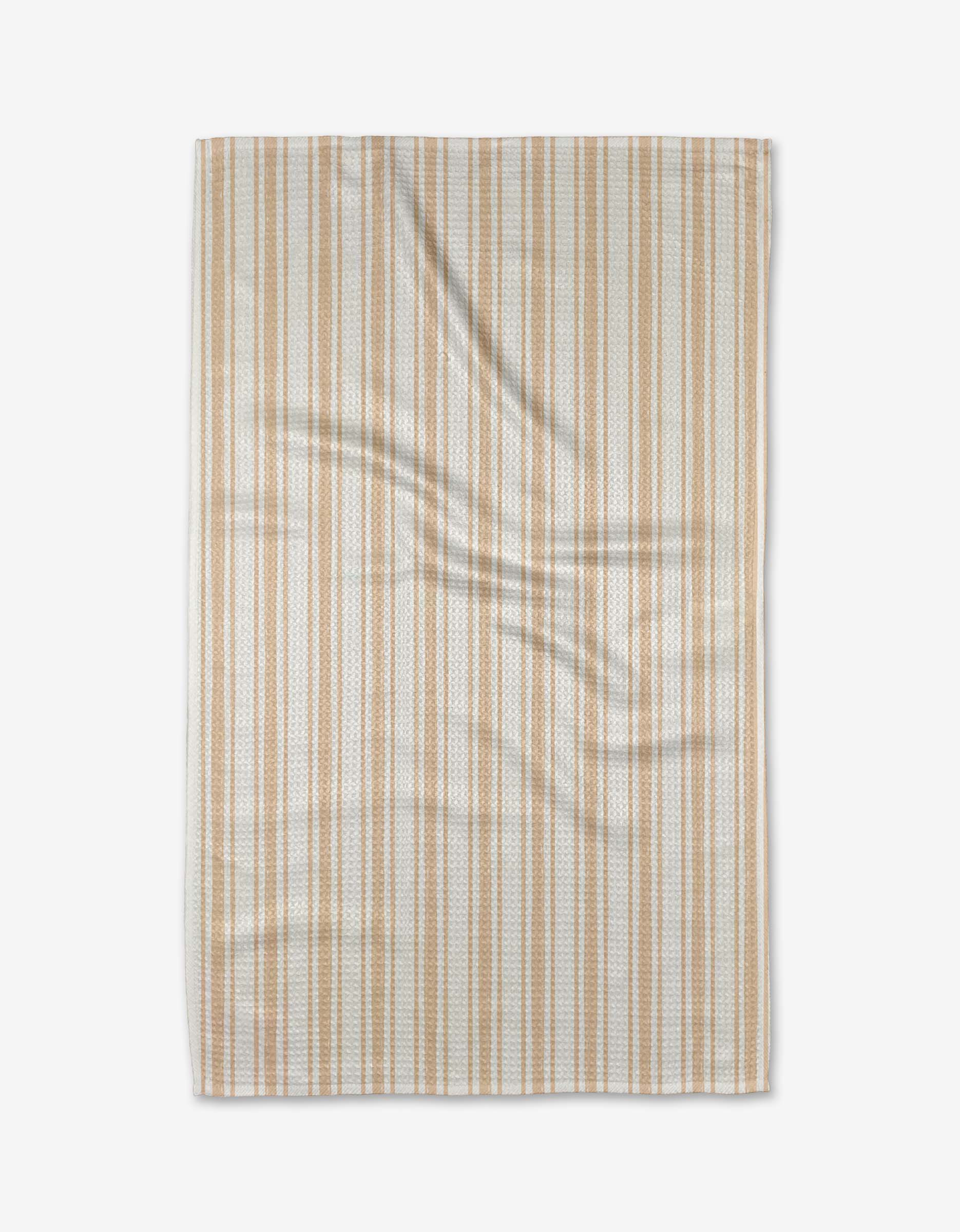 The Hufton Studio Boho Stripe beige and white rectangular kitchen tea towel is displayed flat on a white background, showing its subtle folds and creases.