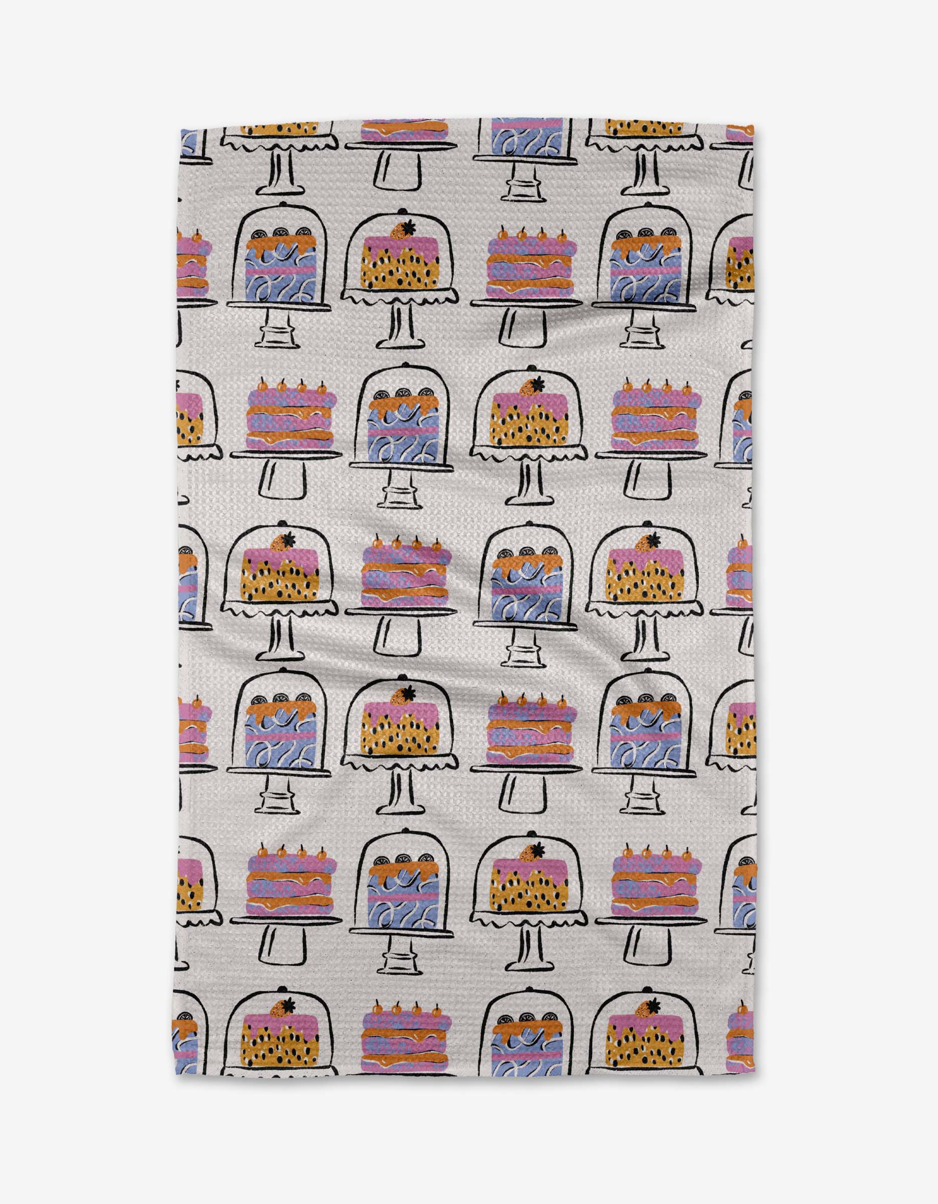 The Cakes In The Window towel by Megan Roy features cakes and pies under glass domes in a grid on white, with pink, purple, and yellow accents. Crafted from ultra-absorbent Geoweave fabric for superior drying.