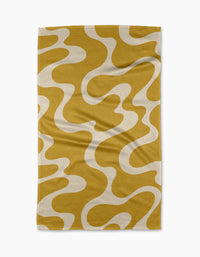 The Gerdadzy Caramel Swirl tea towel features a yellow base with abstract white wavy patterns of soft curves and organic shapes. Ultra-absorbent, it has a slightly textured surface with gentle wrinkles for a stylish kitchen touch.