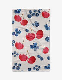 Cherry On Top by Elena Fay: A white tea towel with a repeating pattern of watercolor red cherries and blue blueberries on soft, absorbent Geoweave™ fabric.