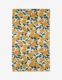 The “Chrysanthemum” tea towel by Vaishali Design Studio features yellow chrysanthemum flowers with green stems on white, bringing charm and absorbency to any kitchen.