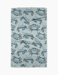 The Mindfulnice Coastal Crew is a textured, light gray recycled kitchen towel with a simple cartoon blue crab pattern. Ultra-absorbent and slightly wrinkled, it’s shown on a white background.