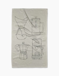 Coffee House by Rosa Kichline is a quick-drying beige tea towel with black line drawings of a Chemex, French press, moka pot, and espresso machine with a cup underneath.