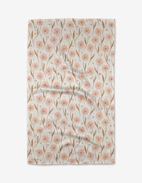 The Daisy Pop Kitchen Tea Towel by Hufton Studio is made from lightweight Geoweave™ fabric and features a repeating pattern of soft pink flowers with brown stems on a white background. The towel is displayed flat, showing its elegant design.