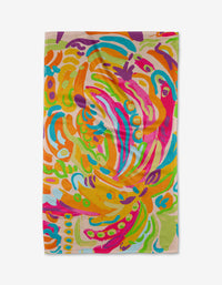 Florescence by Sareka Unique is a vibrant Geoweave tea towel with bold, swirling abstract patterns in orange, pink, blue, green, and yellow on beige—adding a playful splash of color to any kitchen.