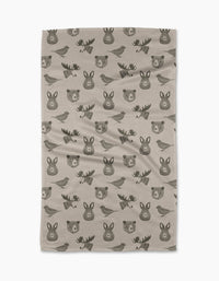 The Forest Animals tea towel by Rosa Kichline features beige fabric with a repeating pattern of simple, dark brown cartoon-style bears, moose, rabbits, and birds. Quick-drying and practical, it brings charm to any kitchen.