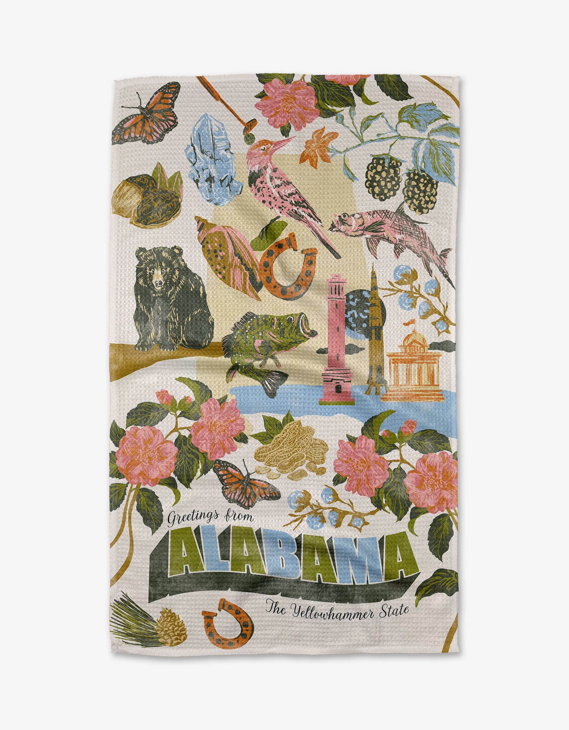 The Geometry "Greetings From Alabama" tea towel is ultra-absorbent, made from recycled materials, and features bright Alabama symbols—camellias, a bear, butterflies, peaches—with “Greetings from ALABAMA The Yellowhammer State.”.