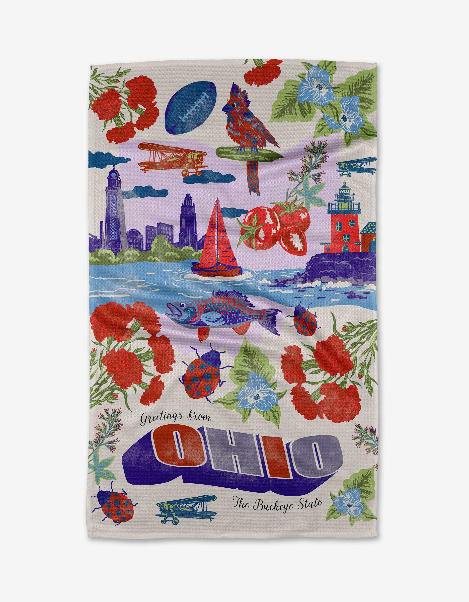 The Geometry "Greetings From Ohio" towel is made from recycled materials and features colorful Ohio symbols, including a skyline, sailboat, tomatoes, cardinals, buckeye leaves, flowers, and bold “Greetings from Ohio” text.