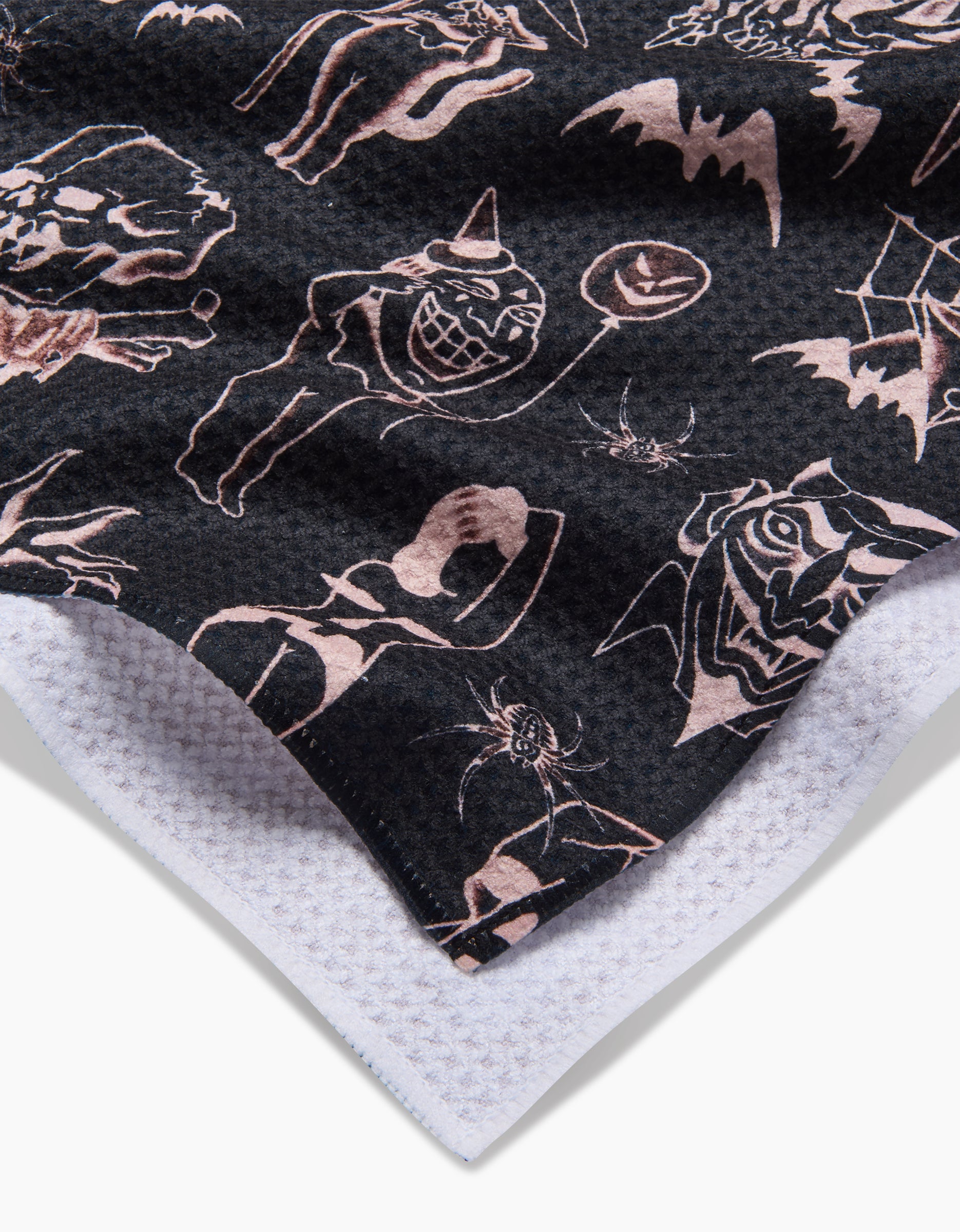 The Cole Strem Halloween Flash features black Geoweave fabric with a white edge and off-white spooky motifs—bats, pumpkins, witches, spiders, and eerie faces.