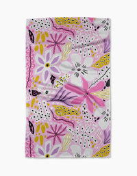 Island Time by Marina Solodka is a rectangular white tea towel with a lively abstract floral pattern, featuring pink, purple, yellow, and black shapes in a whimsical design.
