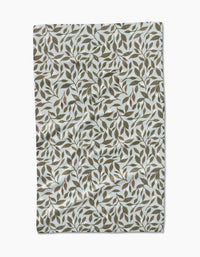 The Mint Leaves tea towel by Katie OShea features Geoweave fabric and a dense green and brown leaf pattern on white.