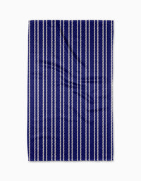 The Geometry Nautical Knots Tea Towel features evenly spaced vertical white rope-like stripes on navy blue Geoweave fabric, shown flat against a white background.