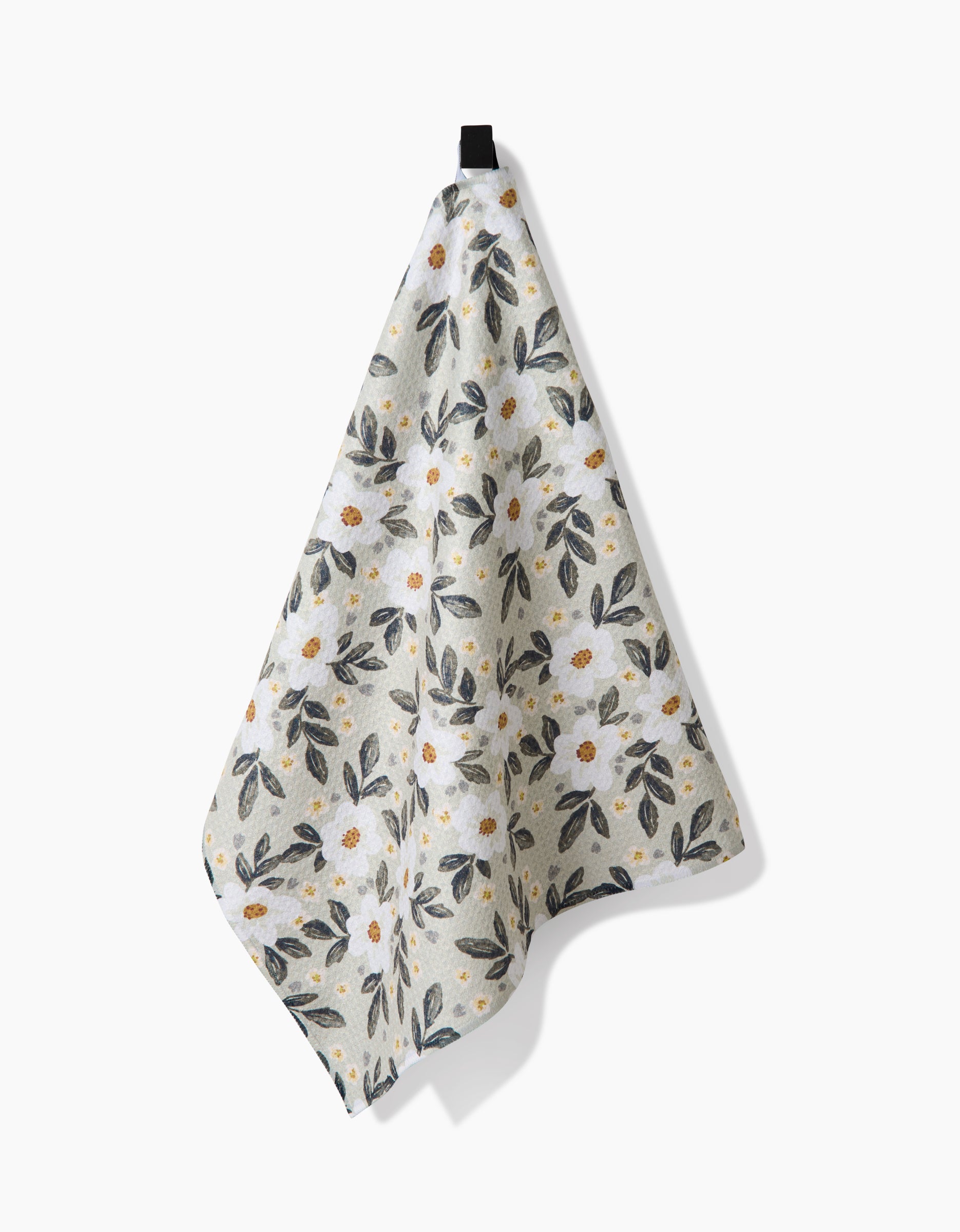 The Teri the Butter Painted Spring Flowers tea towel, made from Geoweave™ fabric, displays yellow and dark gray floral patterns and hangs by a black loop against a white background.