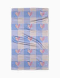 The Pastel Picnic Hearts blanket by Letters By Shells features a blue and cream checkered design with pink hearts in several squares, inspired by a recycled kitchen towel and shown flat against a white background.