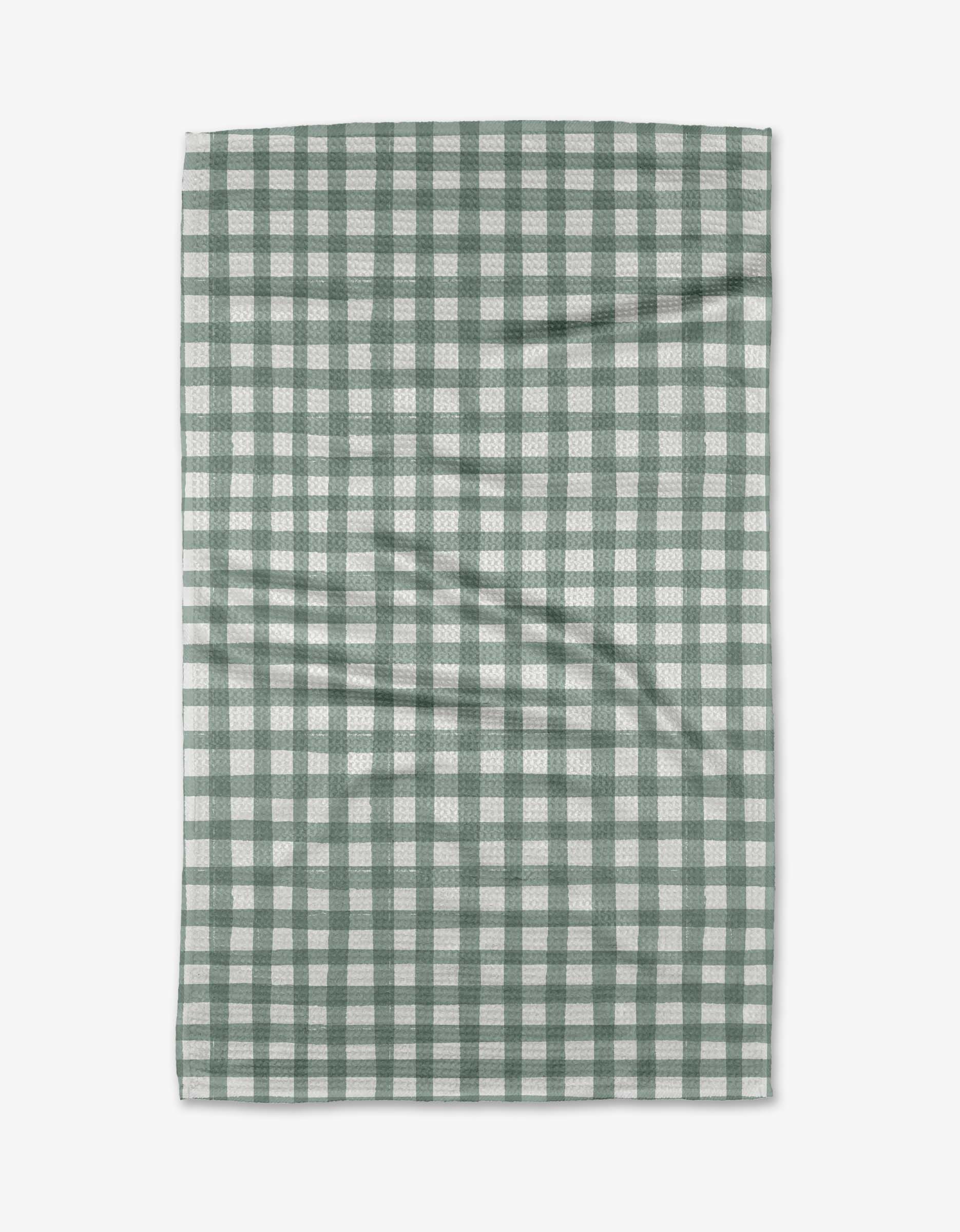 The Picnic Gingham tea towel by Hufton Studio, made from Geoweave™ fabric, features a green and white checkered pattern and is shown flat on a white surface with slight creases.