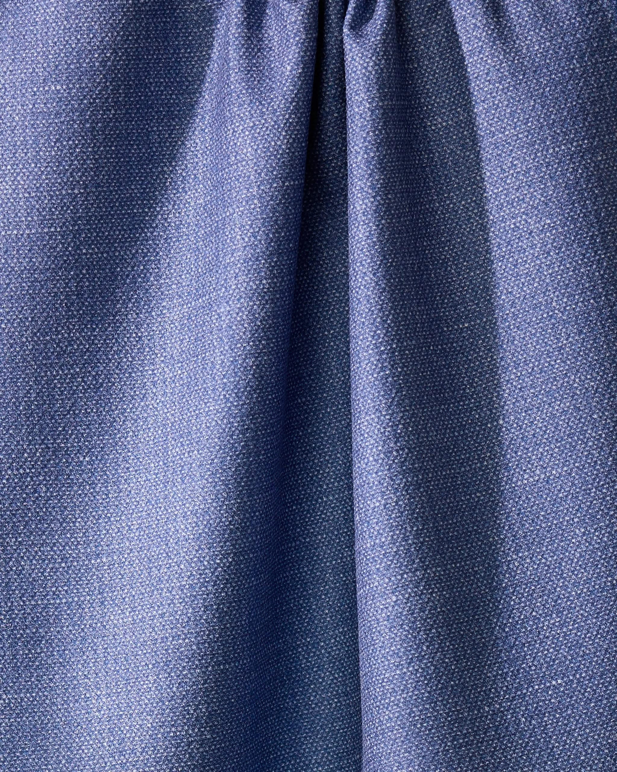Close-up of Geometrys Rainfield, a blue absorbent kitchen towel crafted from recycled materials, with a subtle textured pattern and gathered seam near the top for soft folds and shadows.