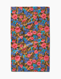 The Retro Garden tea towel by Lisa Nelson features a floral pattern with pink, blue, and red flowers plus green leaves on brown Geoweave fabric thats ultra-absorbent and rectangular.