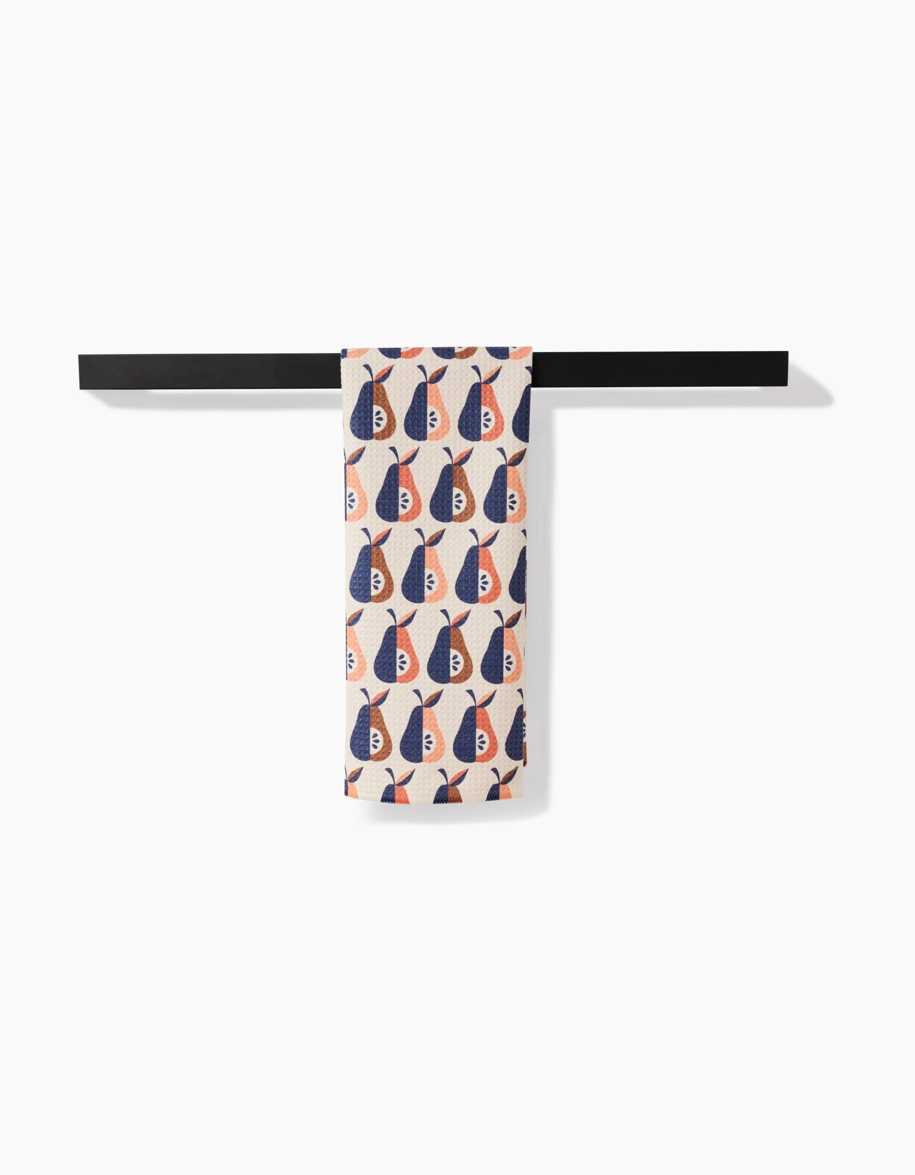 A patterned ultra-absorbent towel, Retro Pears by Megan Kampa, featuring a repeating pear design in vibrant colors, hangs neatly folded over a minimalist black towel bar against a white background.