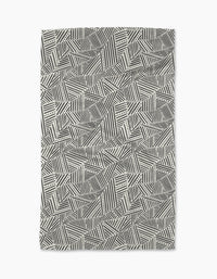 The Rhythm Current Stripes area rug by Sarah Daugherty features a black and white geometric pattern of overlapping lines, dots, and zigzags—an abstract, modern design perfect for enhancing your stylish kitchen space.