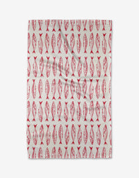 The Sardine Stripes tea towel by Hufton Studio features red, stylized fish in neat vertical rows on white, creating a symmetrical pattern. Made from sustainable materials.